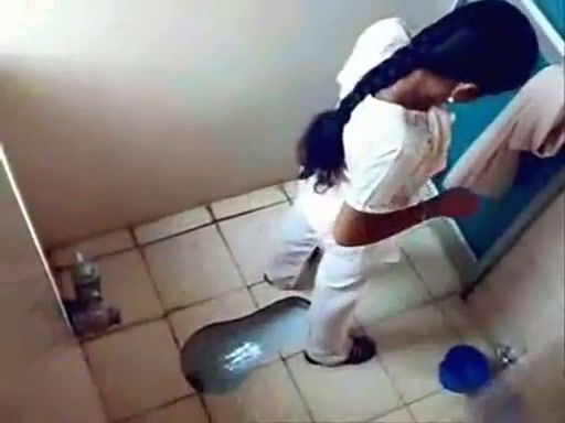 Woman peeing on a camera