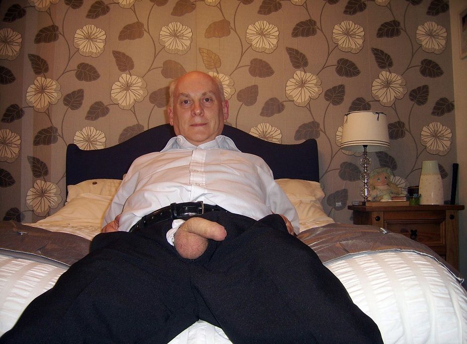 Old men nude on bed
