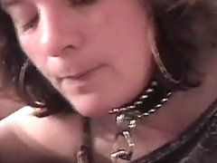 Leashed woman being cum on